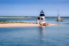 Sailing Past Lighthouse on Nantucket Island on a Summer Day